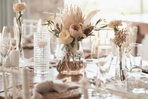 Centerpiece of dried protea, pampas grass and cream roses